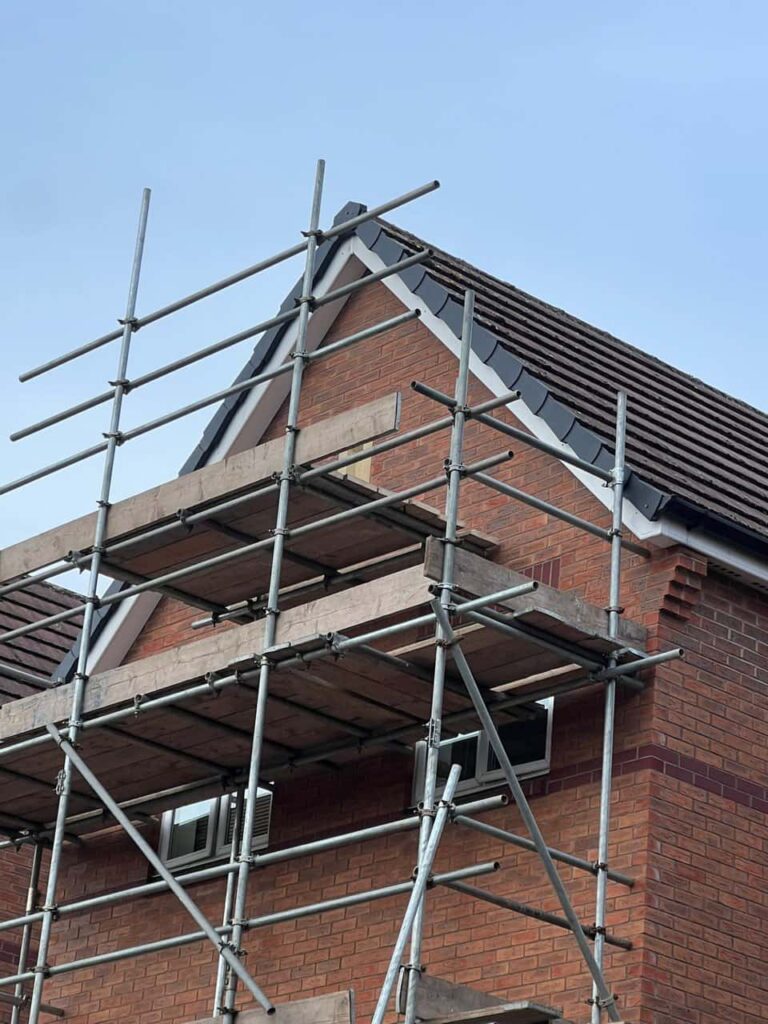 This is a photo of a roof which has just been repaired. There is a scaffold located at the gable end for access onto the roof. Works carried out by MCM Roofing Repairs Salisbury