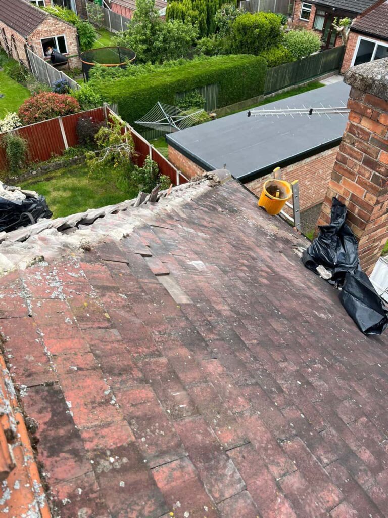 This is a photo of a roof where the hip tiles have been removed, and are just about to be replaced. Works carried out by MCM Roofing Repairs Salisbury