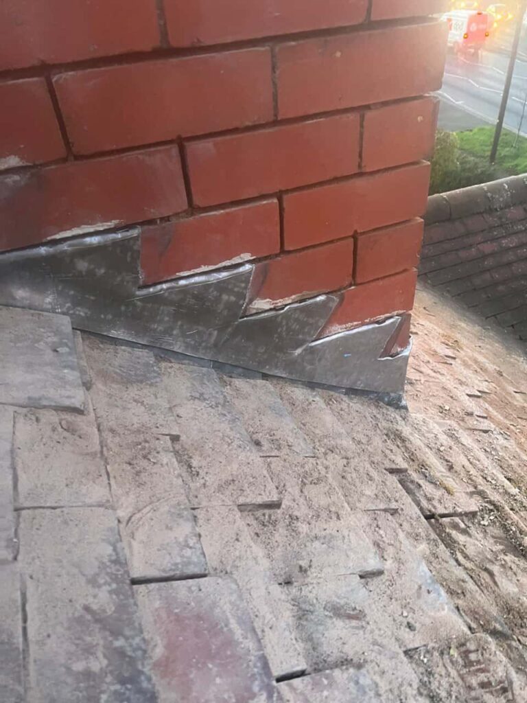 This is a photo of new leadwork being installed around an old chimney. Works carried out by MCM Roofing Repairs Salisbury